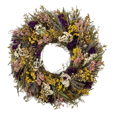 Bright wildflower wreath with yellow, purple, pink, white, and green.