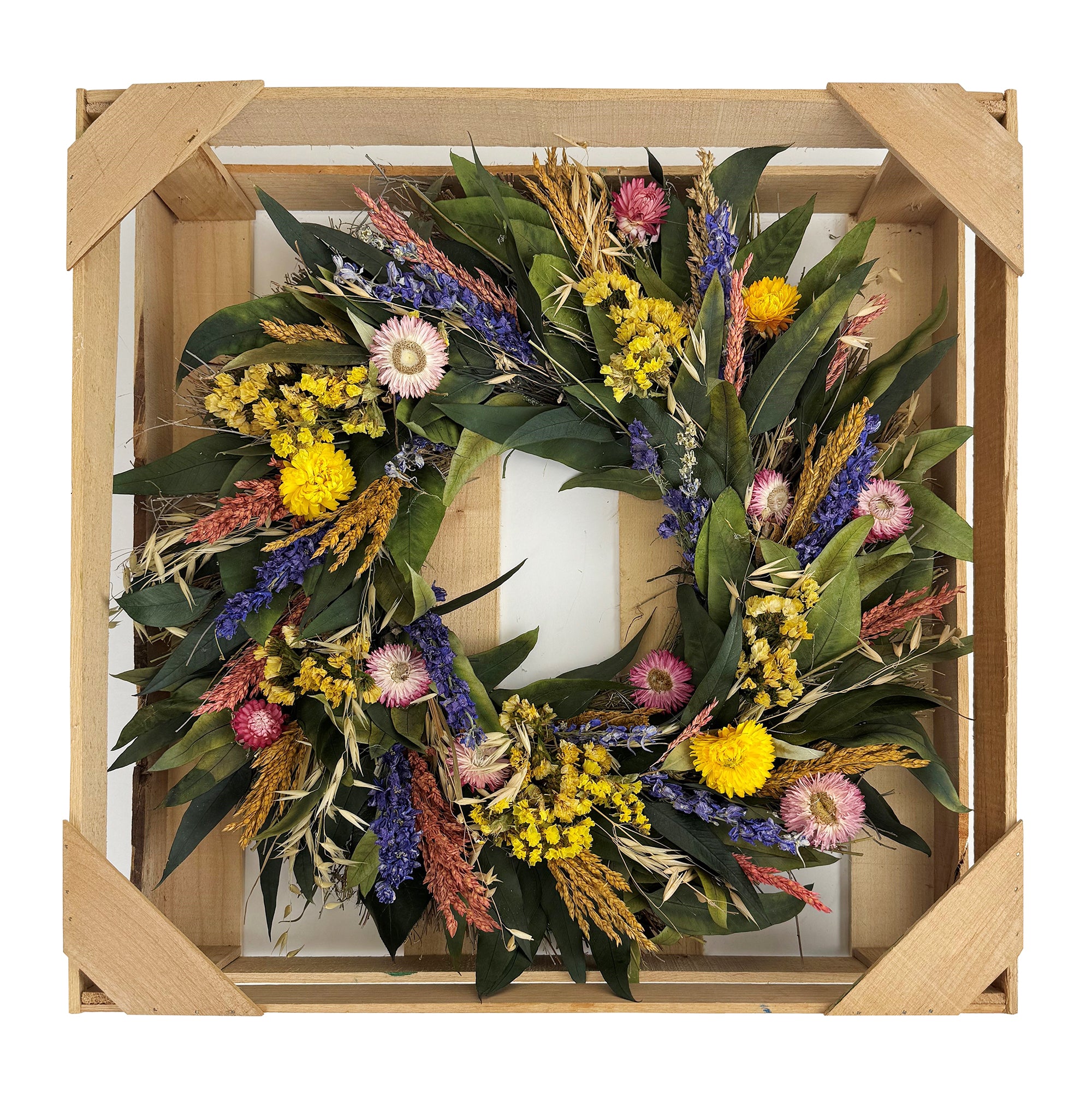 Cambria Wreath with bright colored dried flowers and leaves.