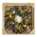 Cambria Wreath with bright colored dried flowers and leaves.