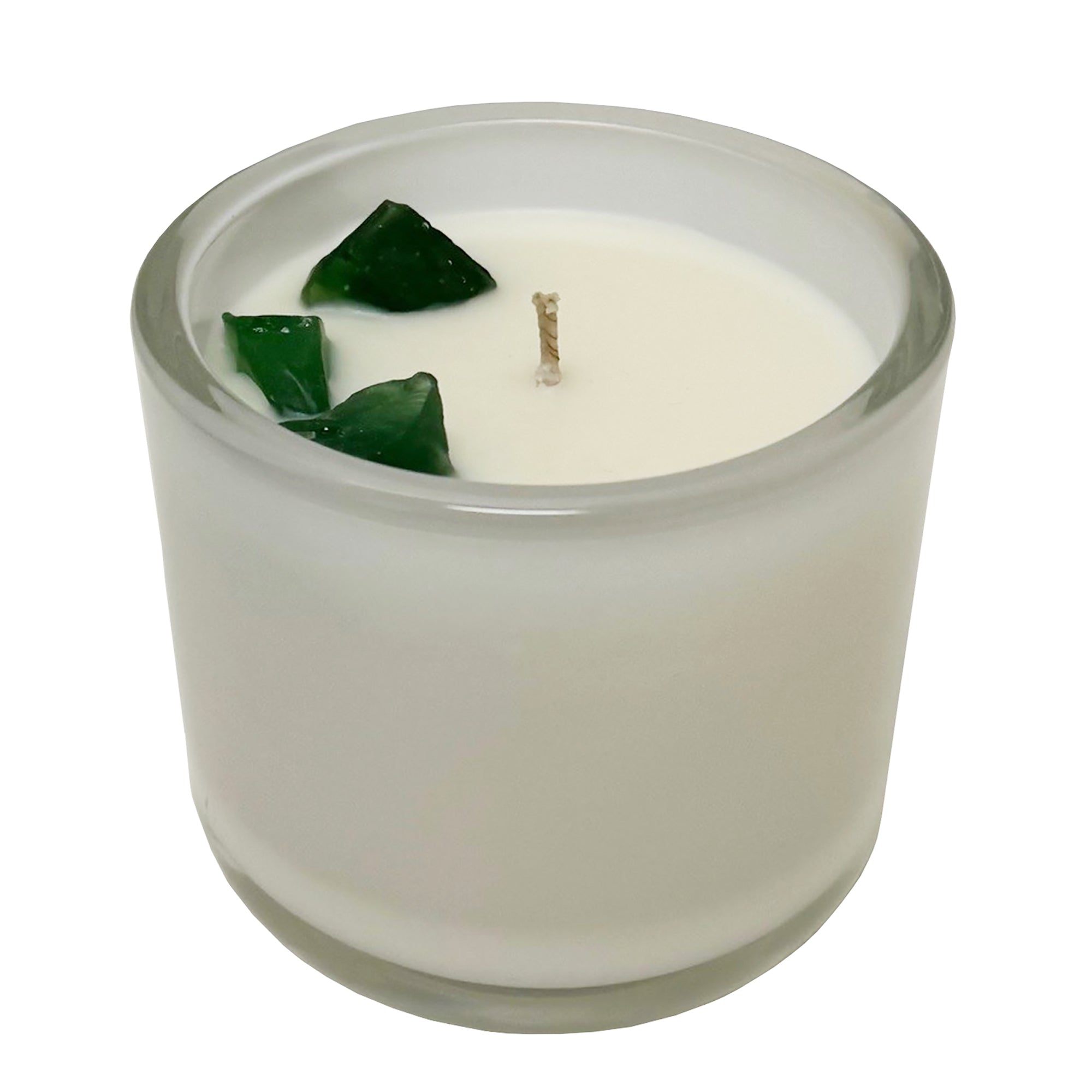 White candle cup with green stones embedded.