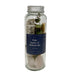 Jar filled with white sage bundle, eucalyptus, palo santo, and stones.