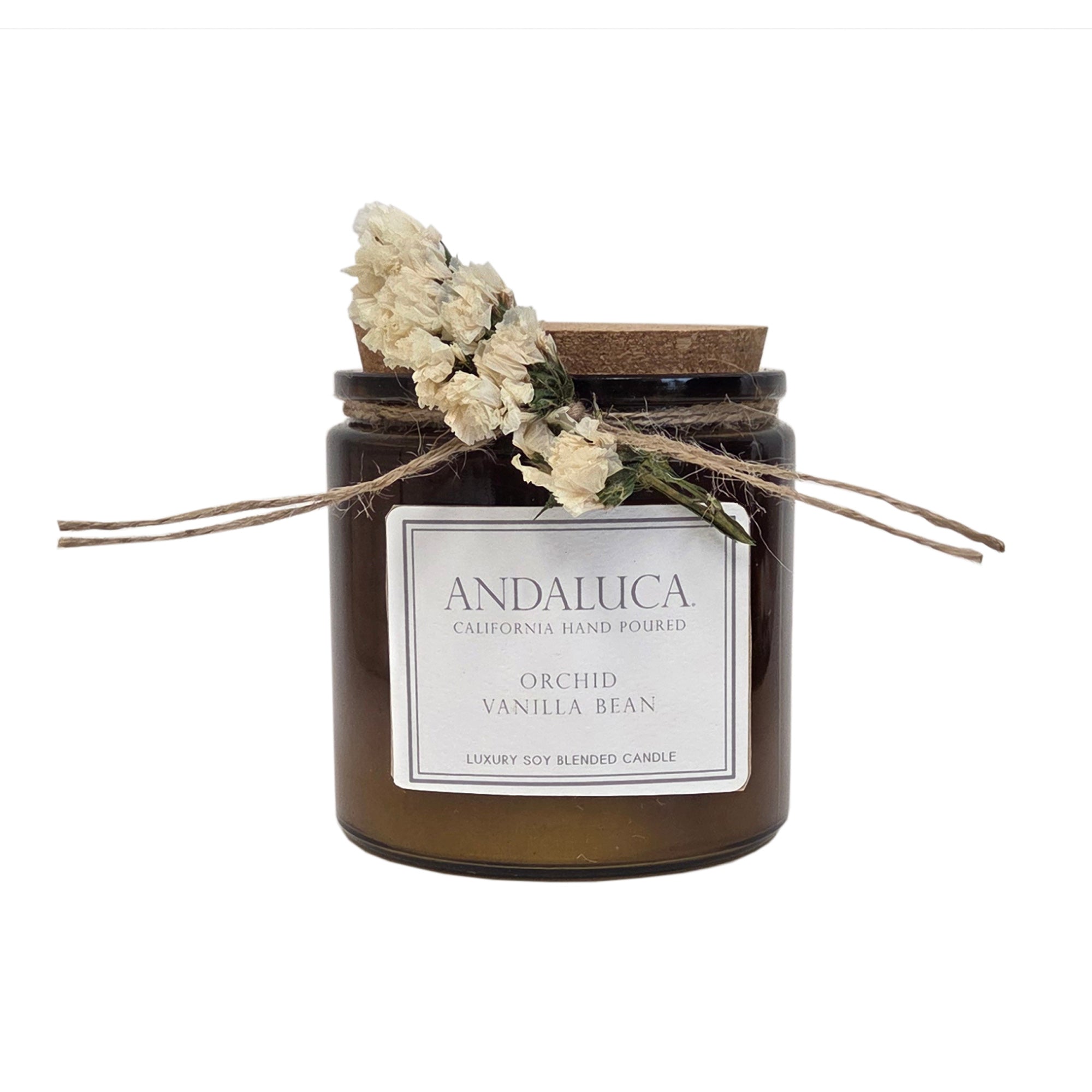 Brown glass candle with ivory flower tied on.