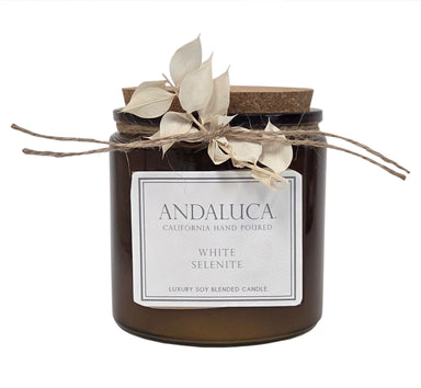 Brown candle glass with ruscus sprig tied on.