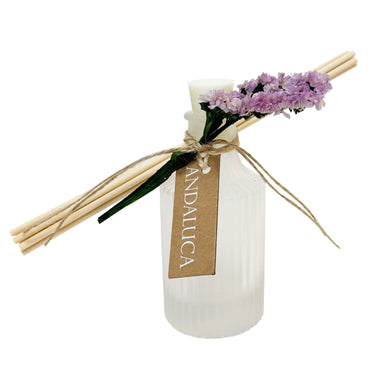 Diffuser with reeds and flowers on a white background