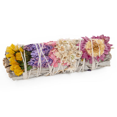 Colorful floral white sage smudge stick.