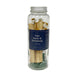 Jar filled with palo santo, stones, and flowers.