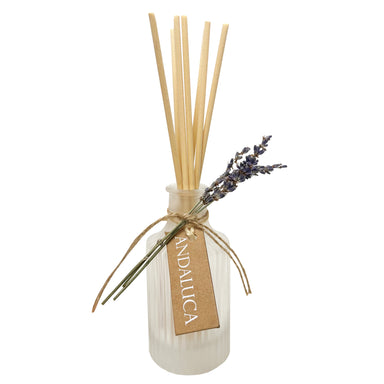 Frosted ridge glass diffuser with reeds and a lavender sprig tied to the bottle.