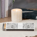 Grey and white box of matches in floral pattern.