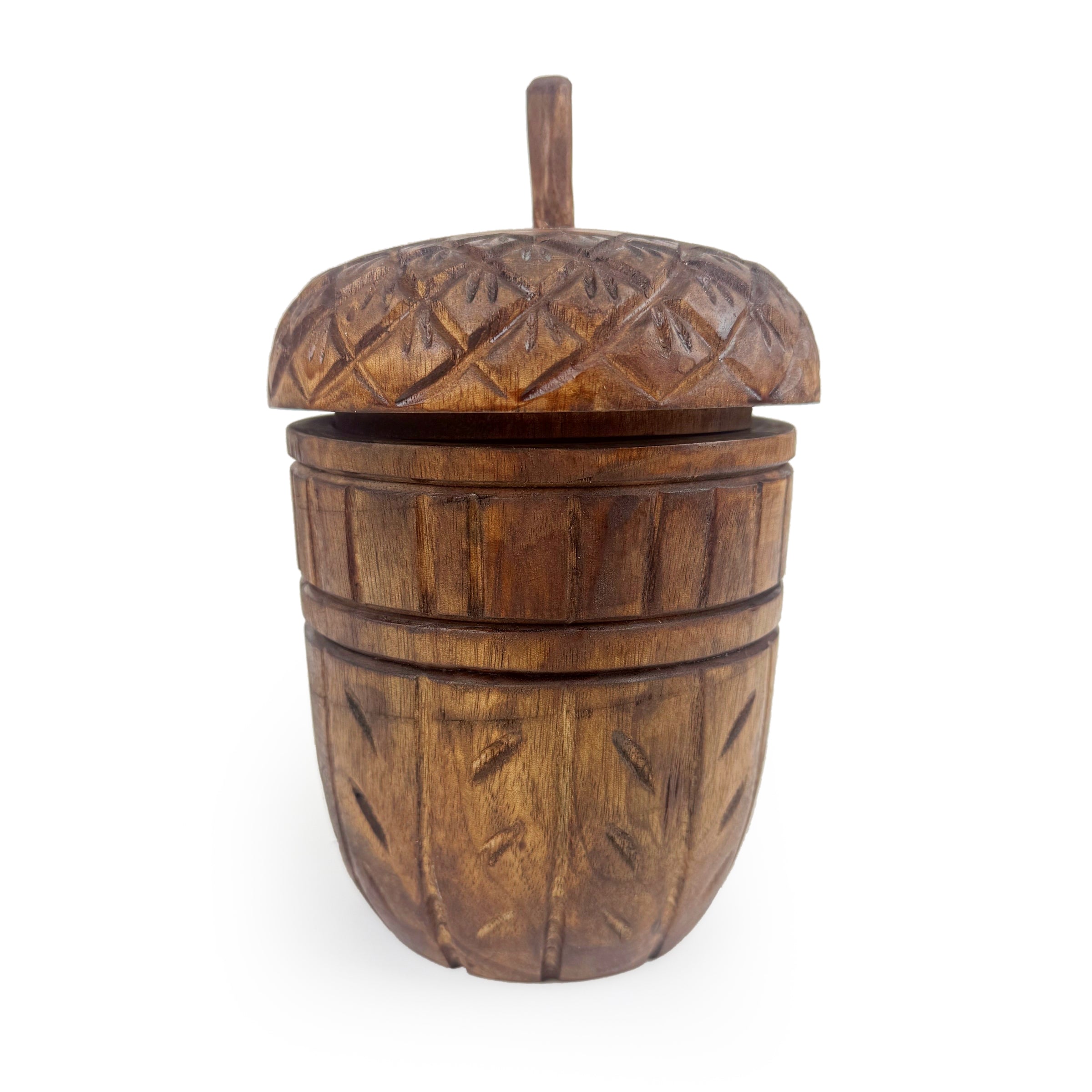 Closed carved Acorn Wood Candle vessel on a white background.