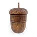 Closed carved Acorn Wood Candle vessel on a white background.