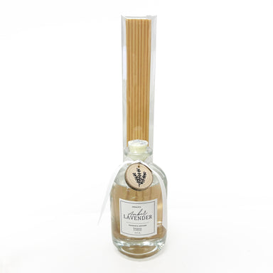 Bottle of lavender-scented reed diffuser with wooden sticks on a white background