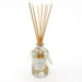 Clear glass diffuser bottle with wooden sticks labeled 'Coppia Vanilla' on a white background
