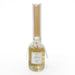 Vanilla-scented bottle with wooden sticks on a white background