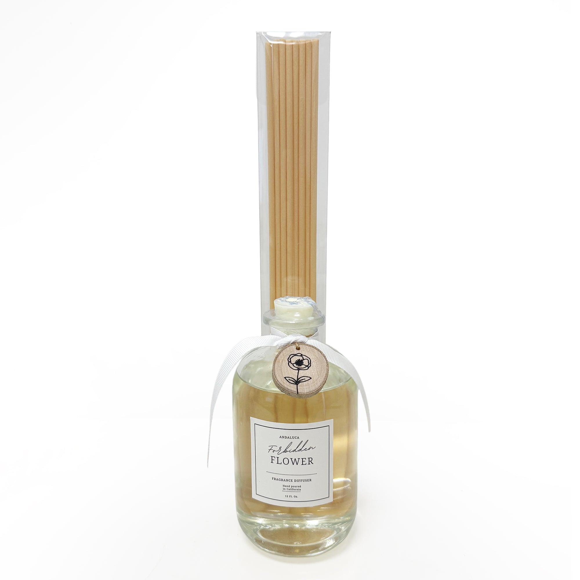Reed diffuser with bottle and sticks on a white background