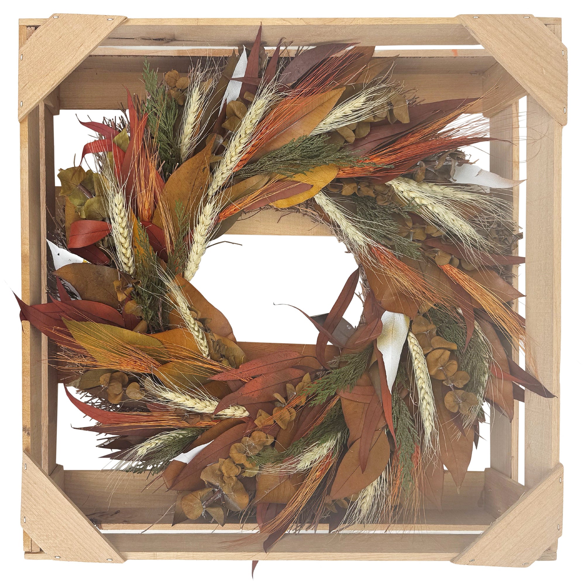 Decorative wreath with autumn colors in a wooden frame on a white background