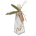 A clear glass bottle with a geometric shape, filled with white salt crystals and dried botanical pieces, topped with a white wax melt. It is decorated with two green dried grass stalks and a brown paper tag that reads 'ANDALUCA'.