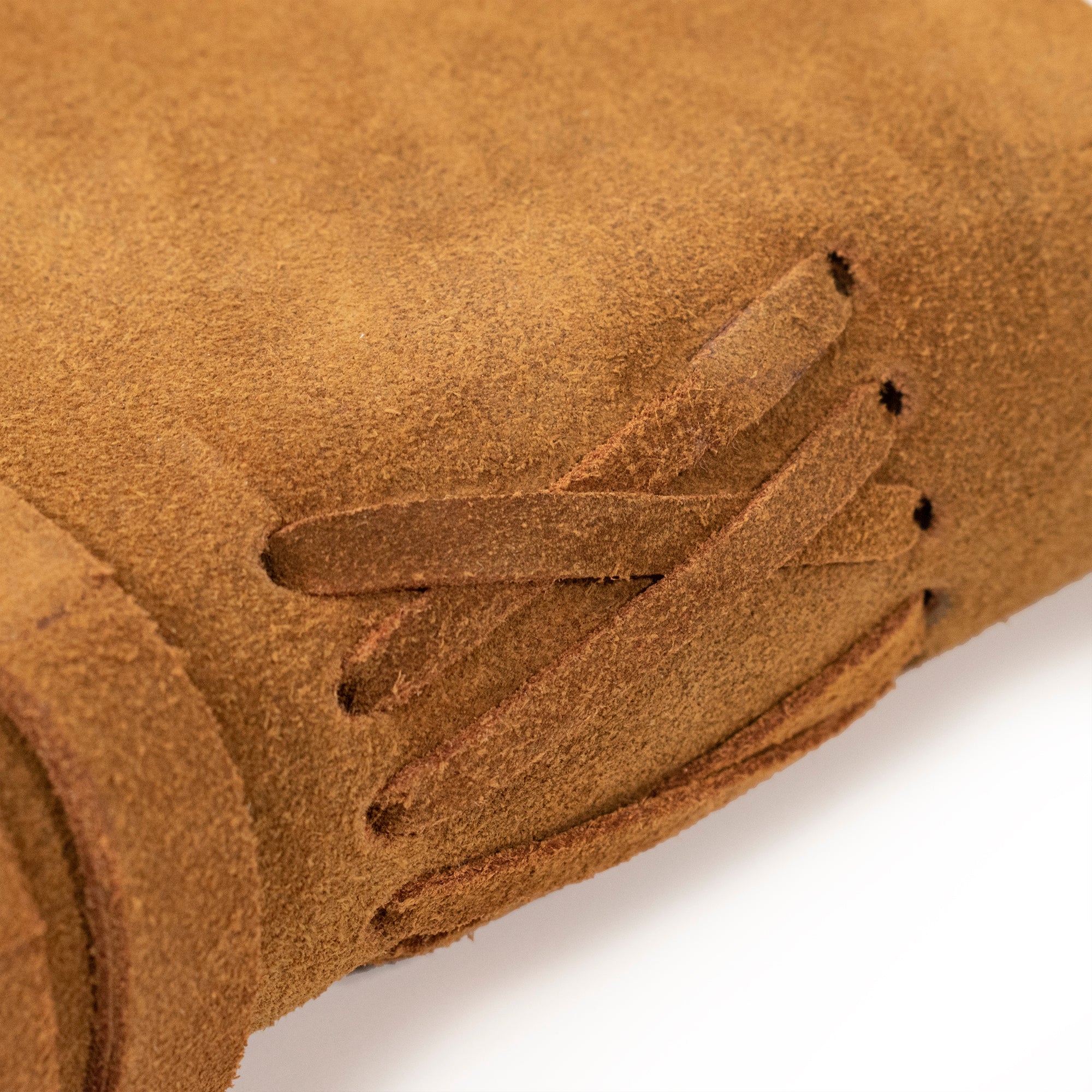 Detail shot of outside spine, of the Cognac color Large Suede Leather Journal w/ Organic Cotton Paper.