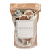 A stand-up resealable pouch of Andaluca California Hand Crafted Bath Salts, filled with coarse white salt crystals and dried citrus slices, green leaves, and herbs, set against a plain white background.