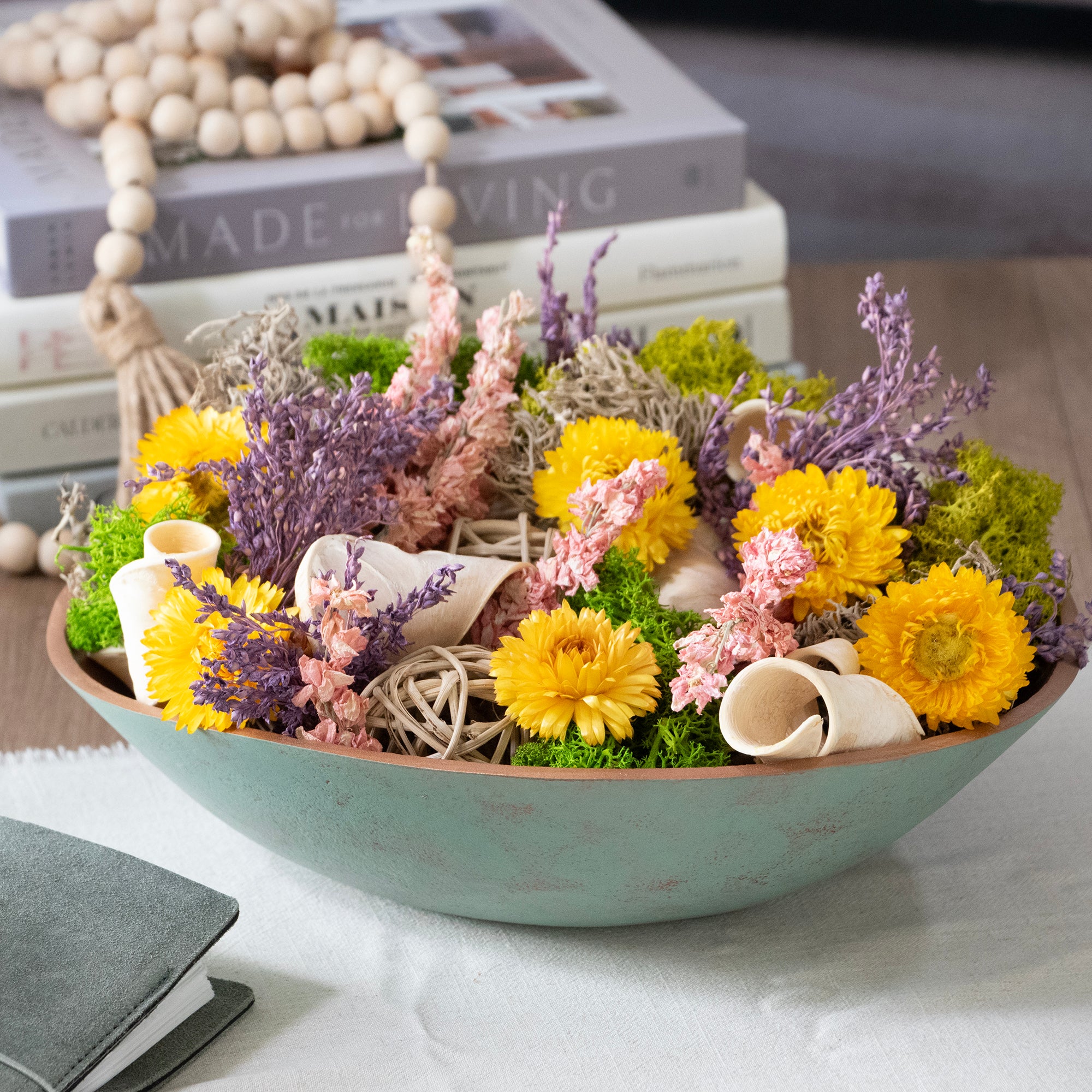 Floral Medley & Moss Bowl Filler, styled in a metal bowl in a room setting.