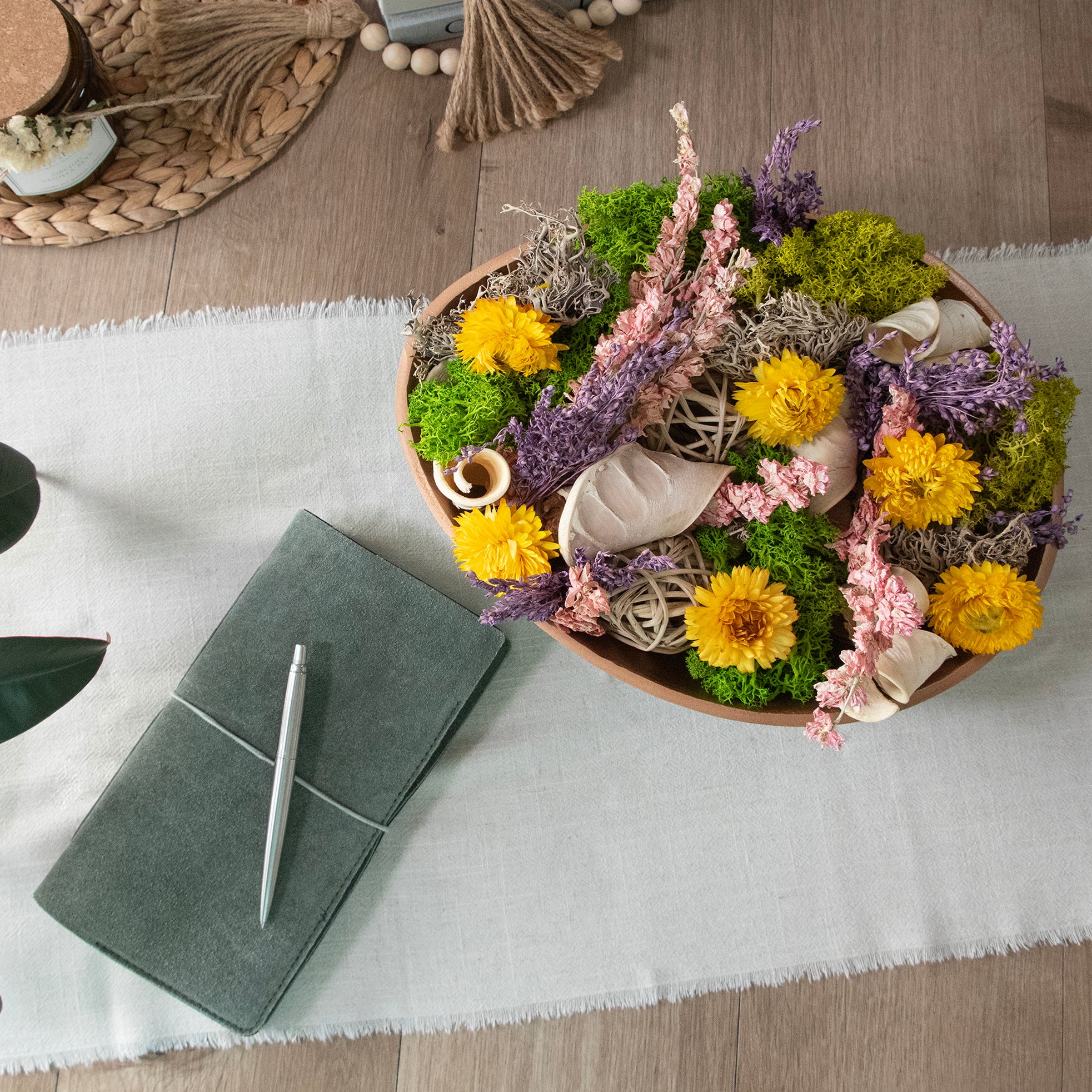 Floral Medley & Moss Bowl Filler, Over head veiw, styled in a metal bowl in a room setting.