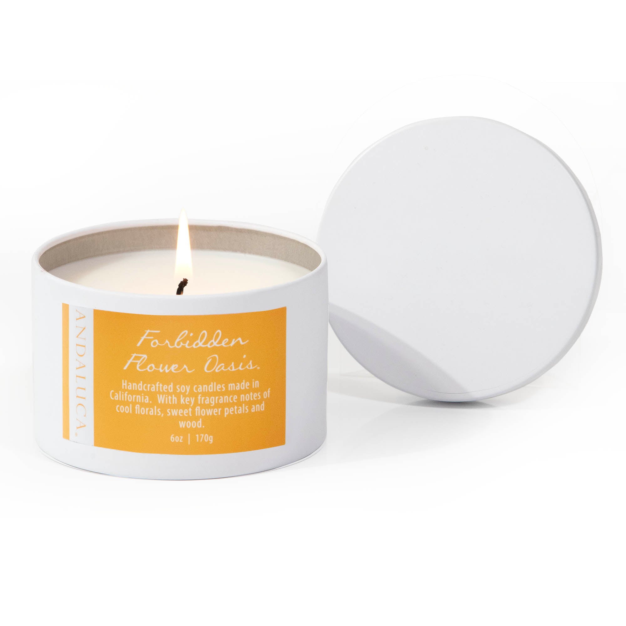 Forbidden Flower Oasis Tin Candle, burning on a white background.