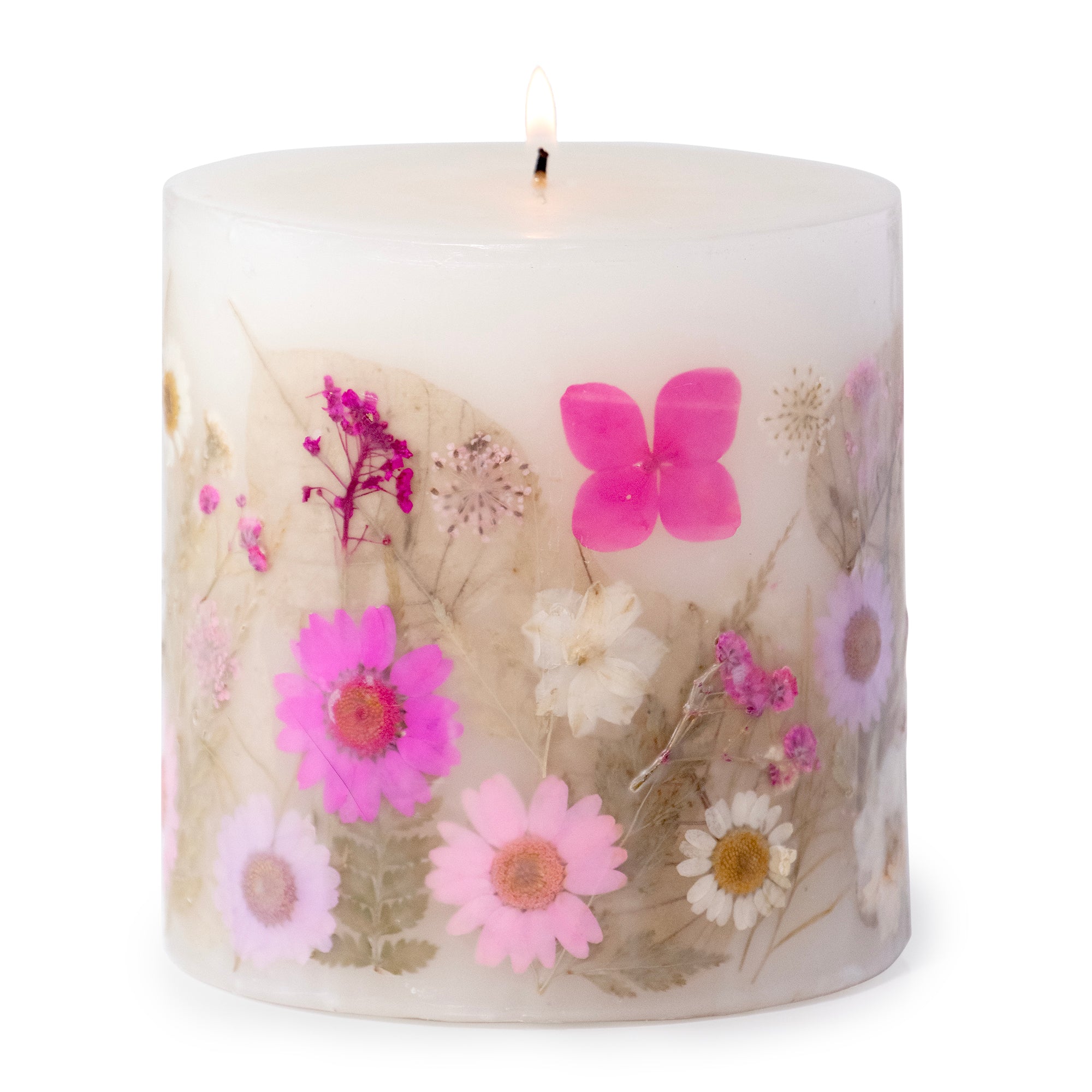 Ivory pillar candle with delicate pink and ivory pressed flowers and green leaves decorating the outside of the candle.