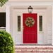 Gold Patina Wreath hanging on a red exterior house front door.