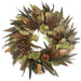 Decorative wreath with green leaves and pinecones on a white background