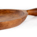 Photo of round teak wood platter with one large handle.