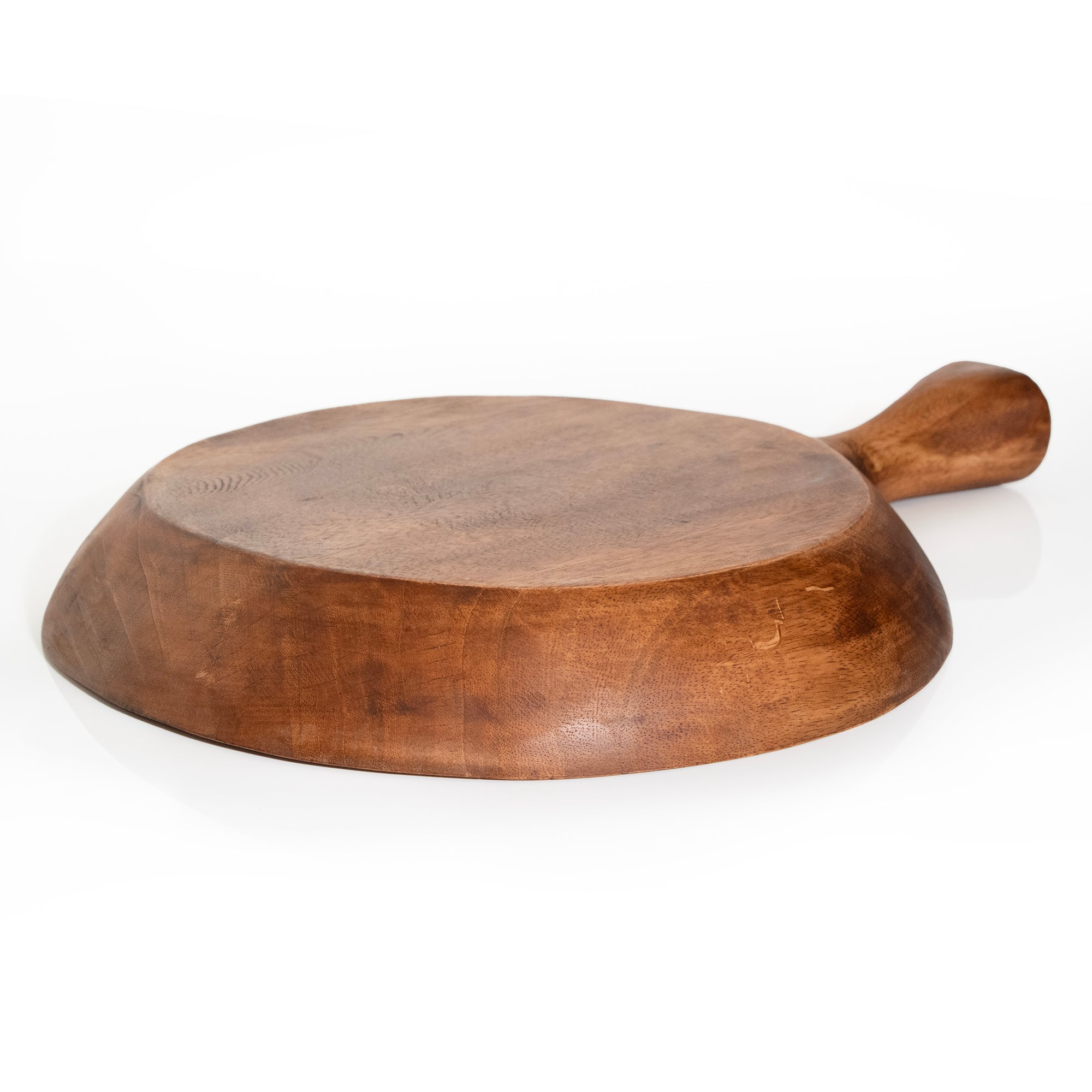 Photo of round teak wood platter with one large handle.