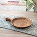 Round teak wood platter with one large handle.