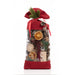 Holiday Memories Burlap Pinecone Bag is a decorative potpourri bag with red burlap fabric on the top & bottom. The bag is clear in the middle allowing it to act as a window to the content of pine cones, oranges, and other botanicals. Shot on a white background.