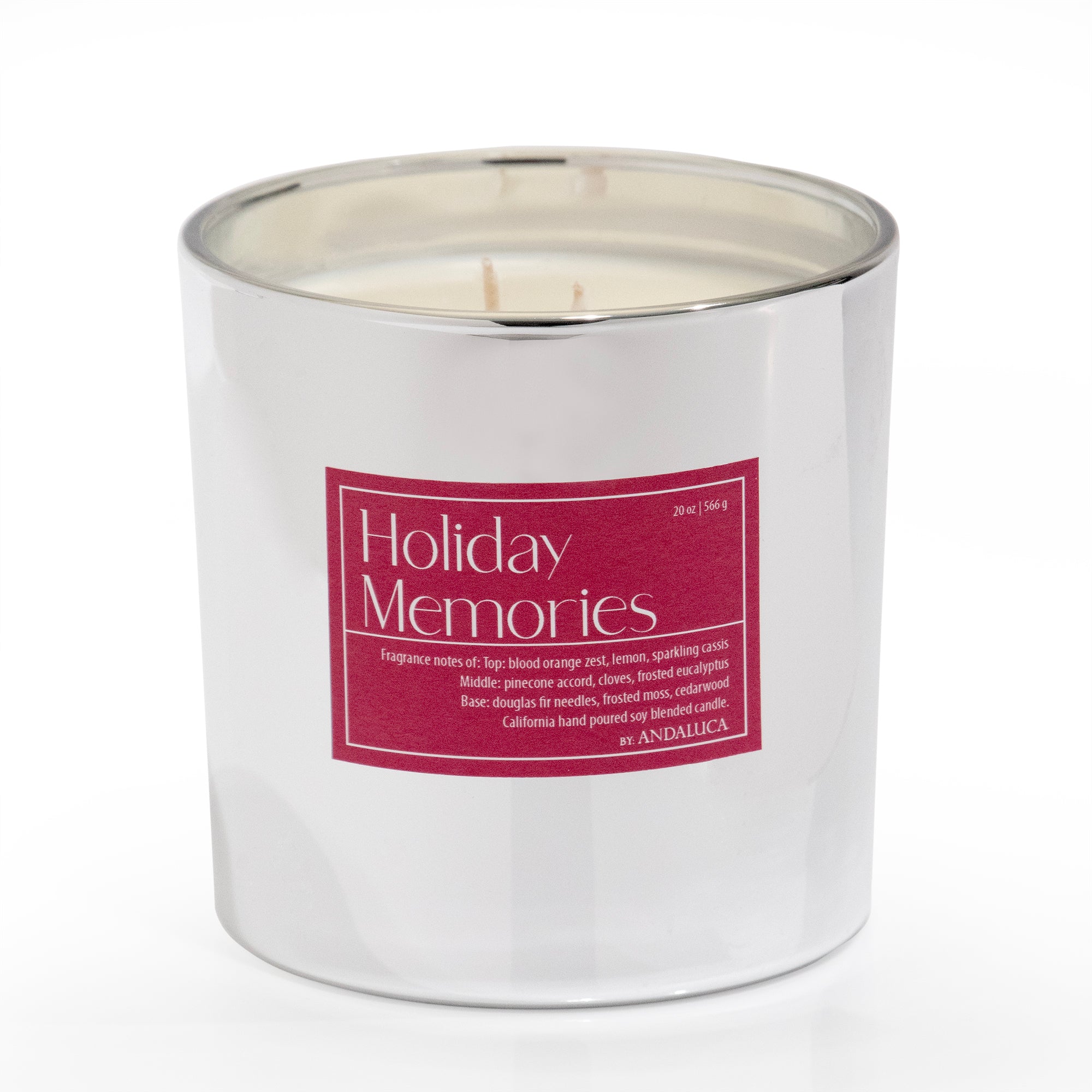 Silver shiny mercury glass filled with candle. Red Holiday Memories label on the candle.