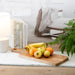 Mango Wood Rectangular Charcuterie Board, with fruit on it,  in a room setting