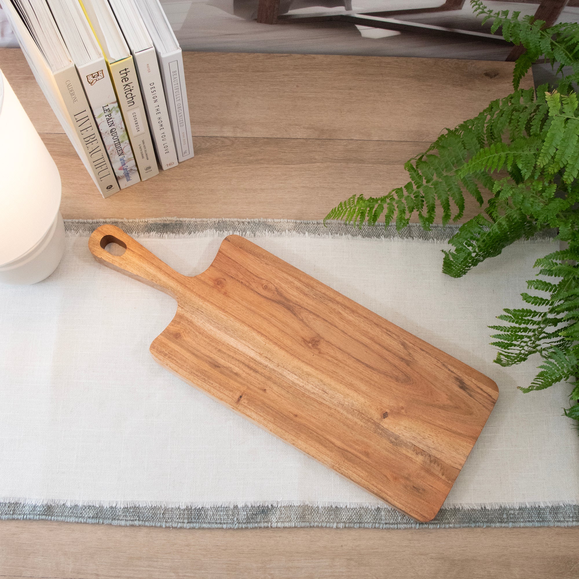 Overhead view of Mango Wood Rectangular Charcuterie Board, in a room setting