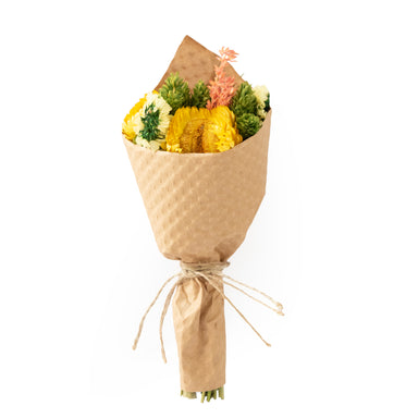 Bouquet of flowers wrapped in brown paper on a white background