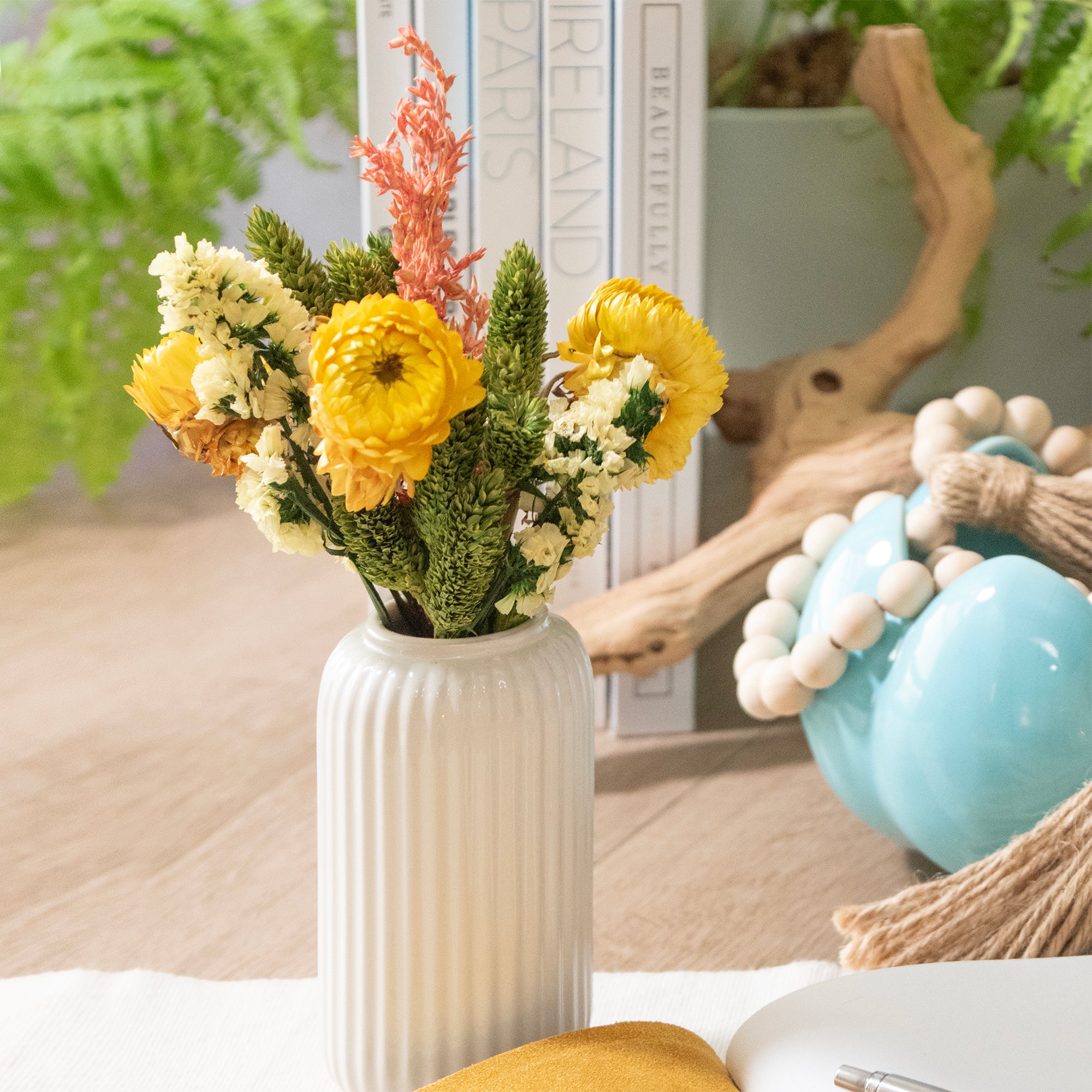 Decorative vase with flowers on a surface with a blurred background