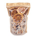 A clear resealable stand-up pouch with a kraft paper top, filled with coarse salt crystals and dried orange slices, photographed on a plain white background.