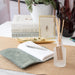 Ocean Plumes Frosted Ridge Glass Diffuser on a desk.