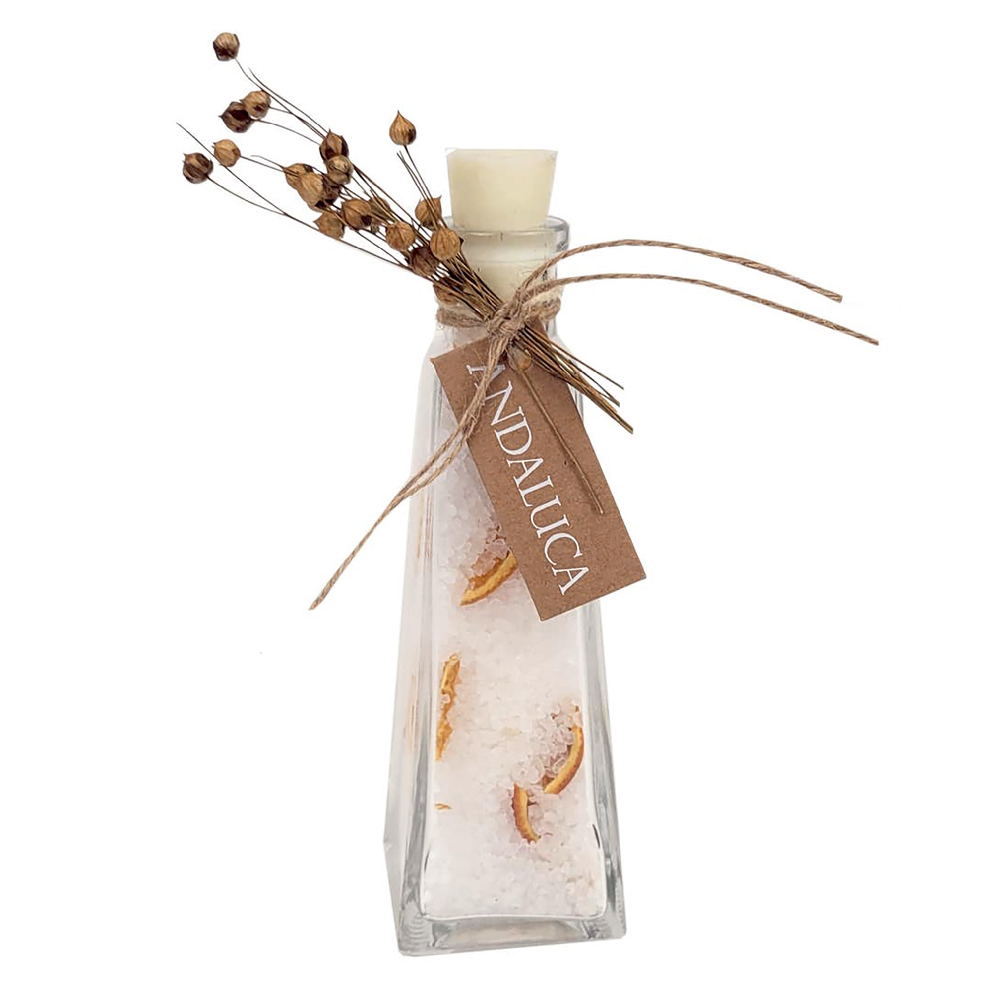 Glass bottle filled with bath salt and dried orange slices.