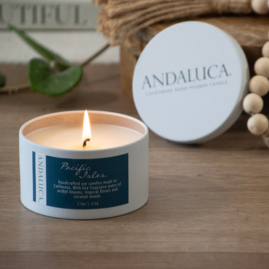 Pacific Isles tin candle burning.