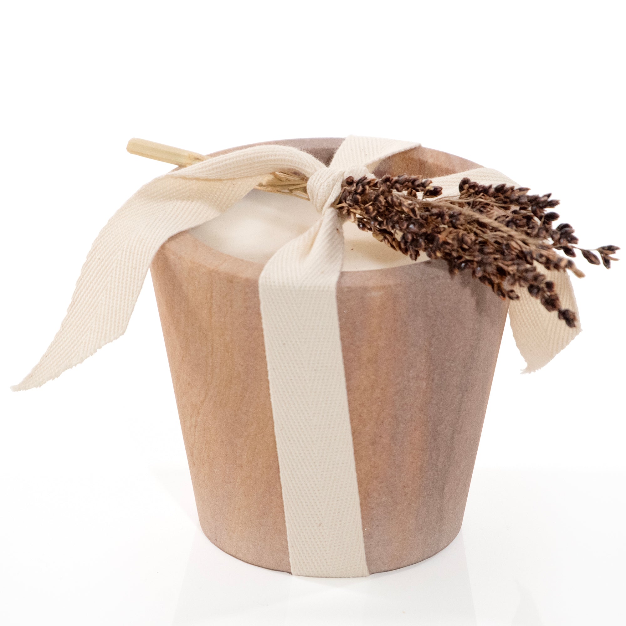 Travertine candle cup with ribbon and botanical tie.