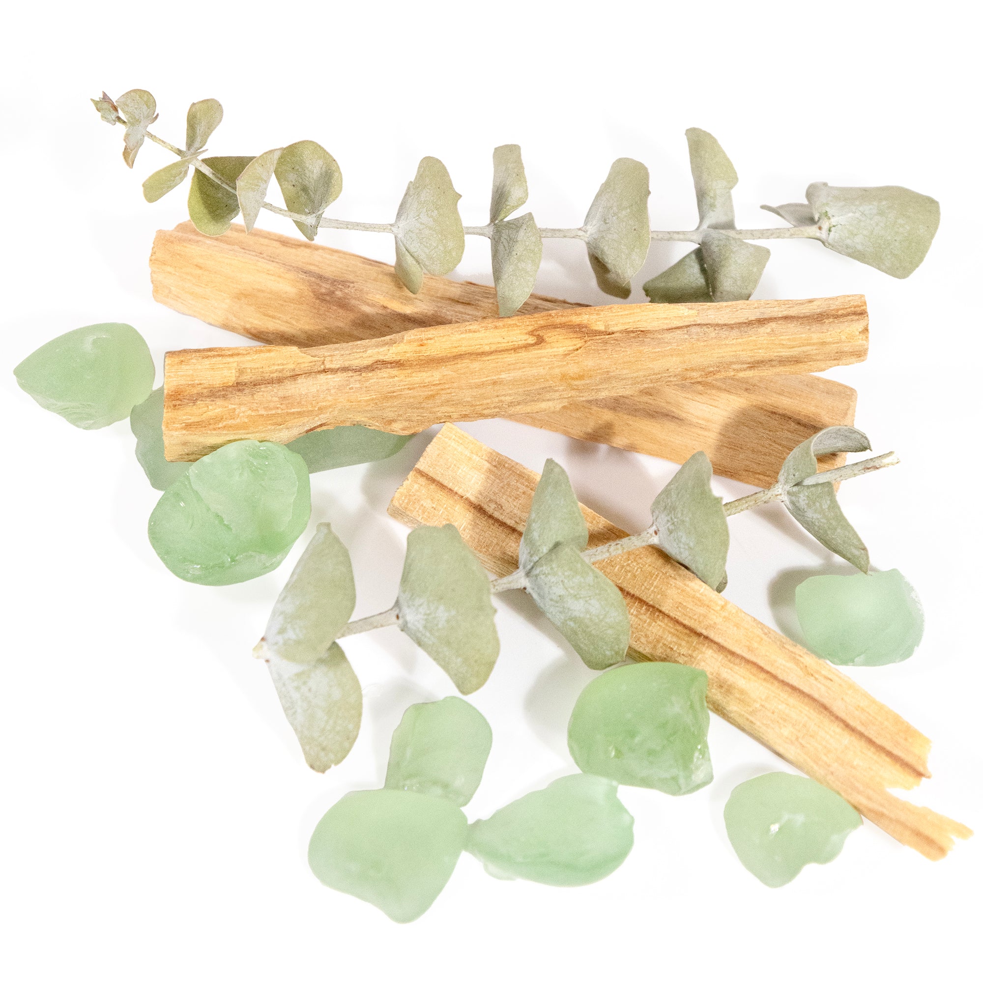 Contents of jar,  palo santo, eucalyptus and stones a pile.
