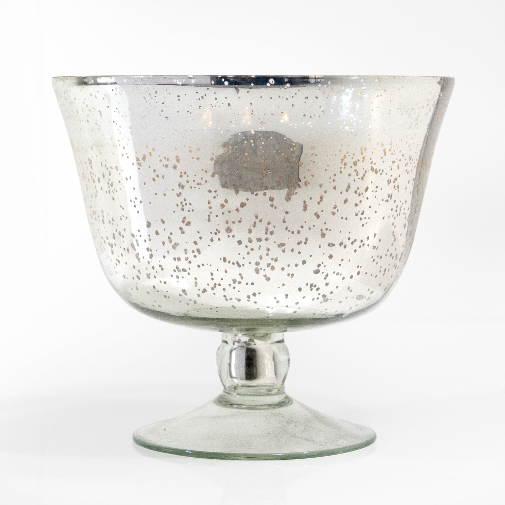 Silvery mercury glass pedestal with candle.