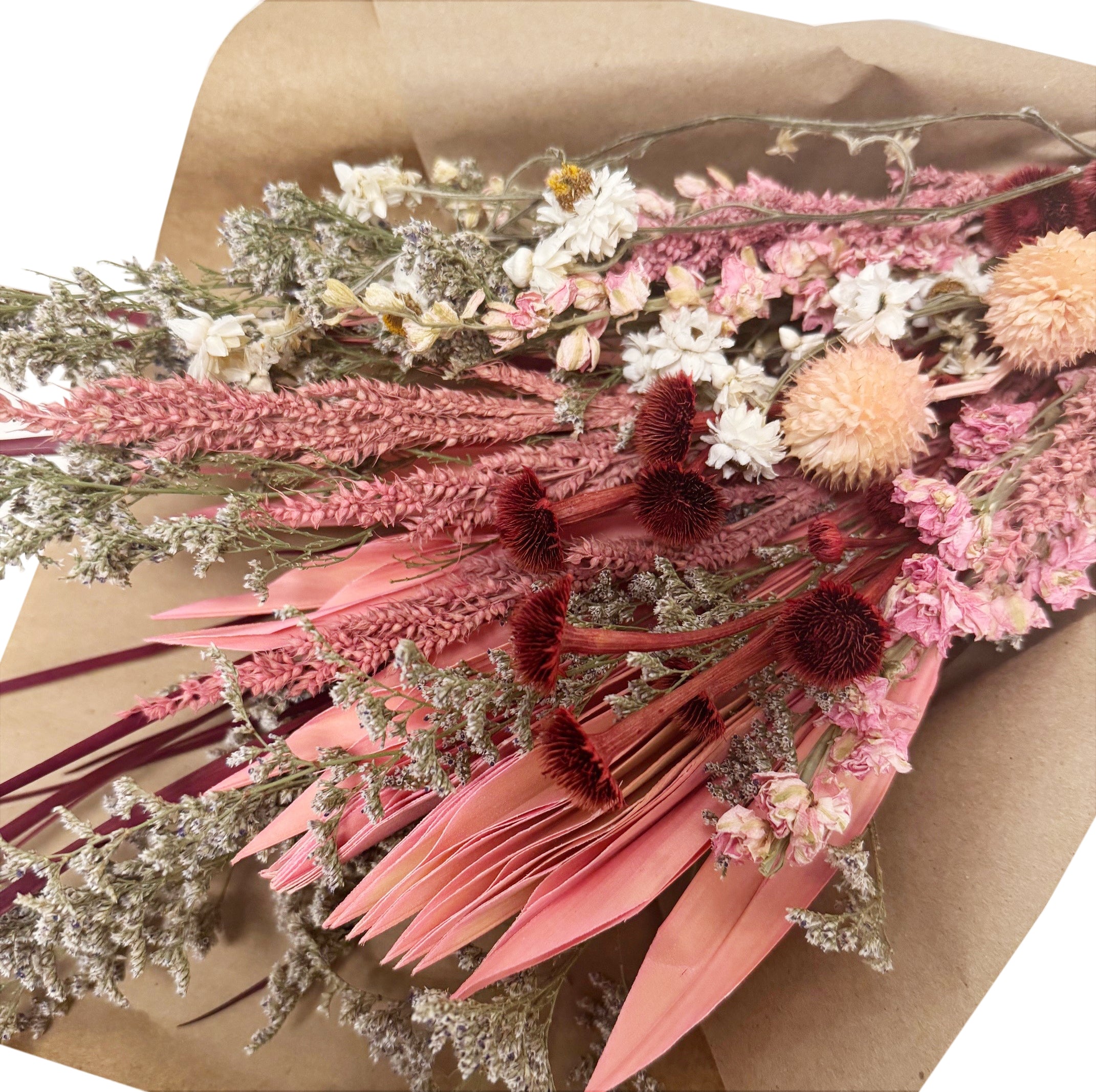 Dried flower bouquet with pink, white, and natural colors.