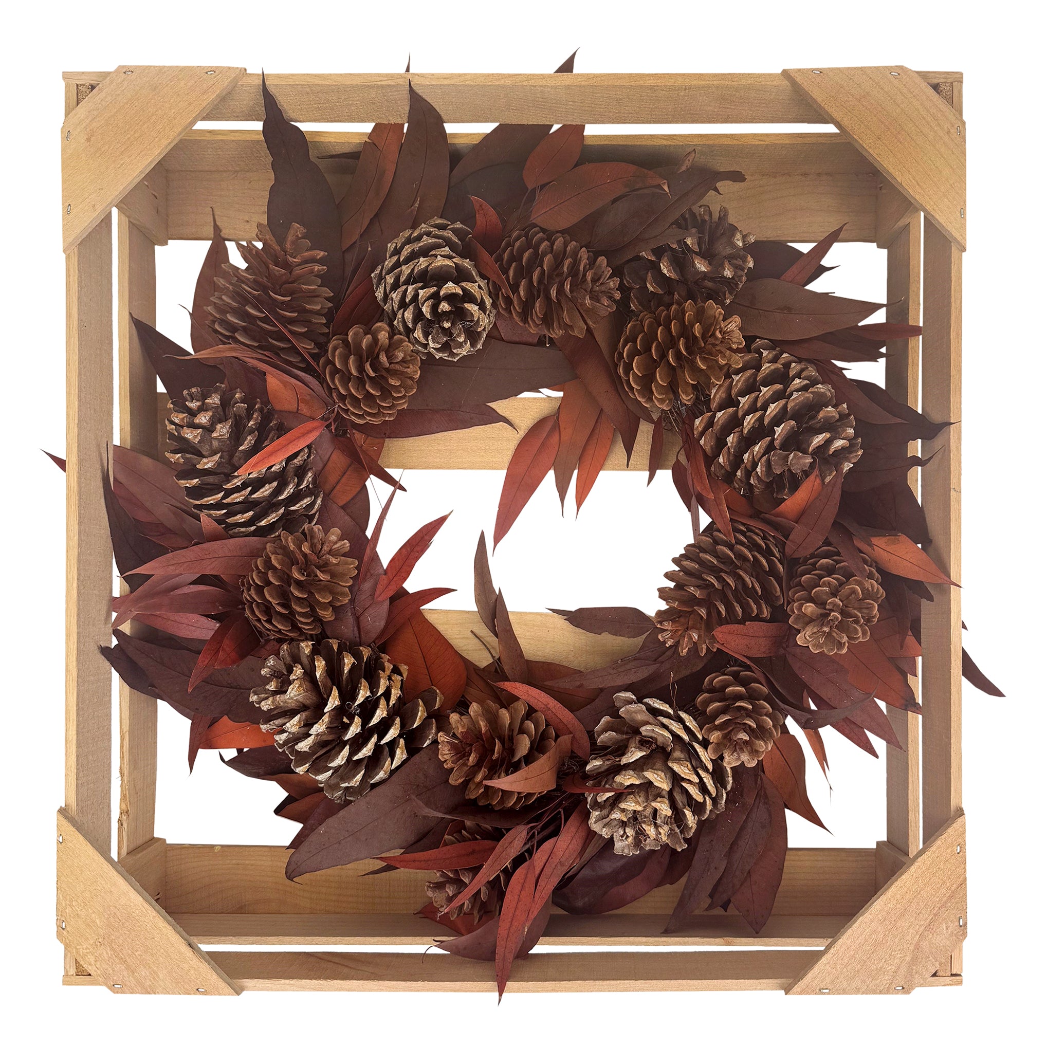 Rustic natural material wreath with pinecones and leaves.