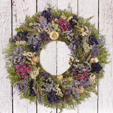 San Anselmo Wreath, on whitewash fence.