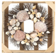 Wreath made from brown starfish, clamshells, and white conch shells on brown twig wreath base.