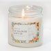 Clear glass filled with white wax candle, with a colorful label.