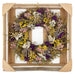 Bright wildflower wreath with yellow, purple, pink, white, and green.